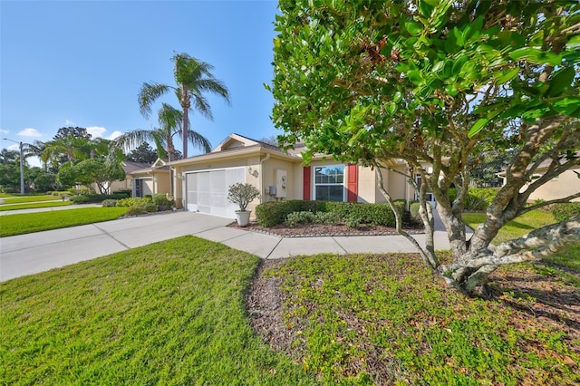 view of front of house with a garage and a front lawn