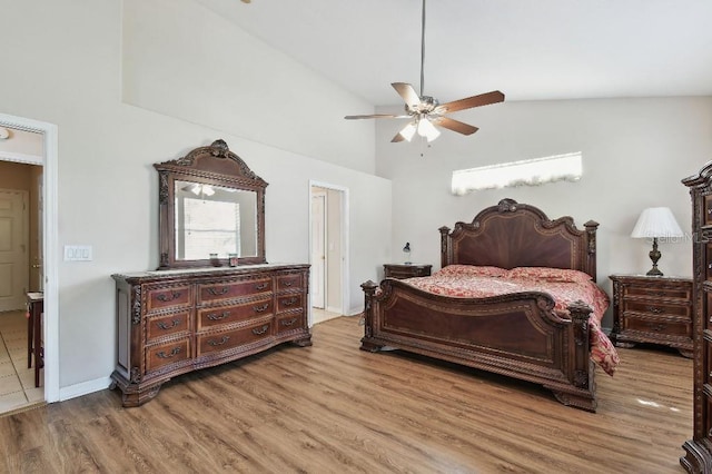 bedroom with wood-type flooring, ceiling fan, and high vaulted ceiling