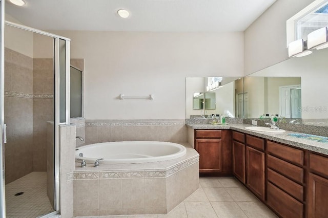 bathroom featuring tile patterned flooring, vanity, and independent shower and bath