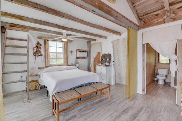 bedroom featuring a wall mounted AC, light wood-type flooring, and beam ceiling