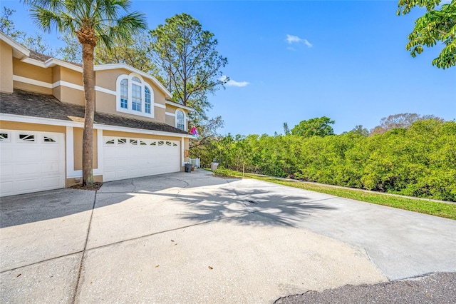 view of property exterior with a garage