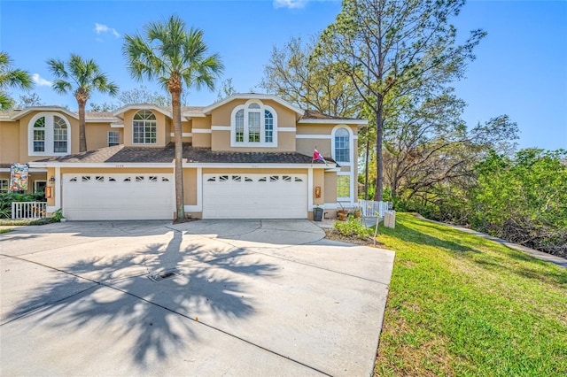 view of front of house with a garage and a front yard