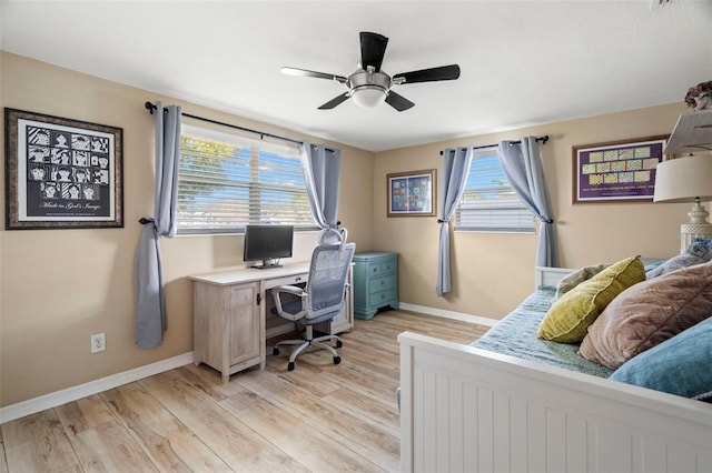 office area with ceiling fan and light wood-type flooring