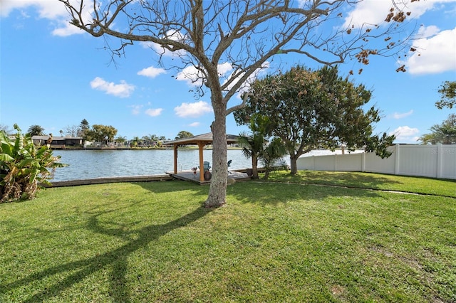 view of yard featuring a gazebo and a water view