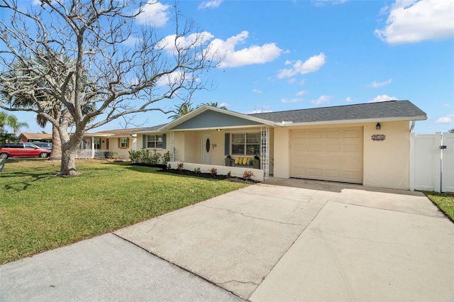 single story home featuring a garage, covered porch, and a front lawn