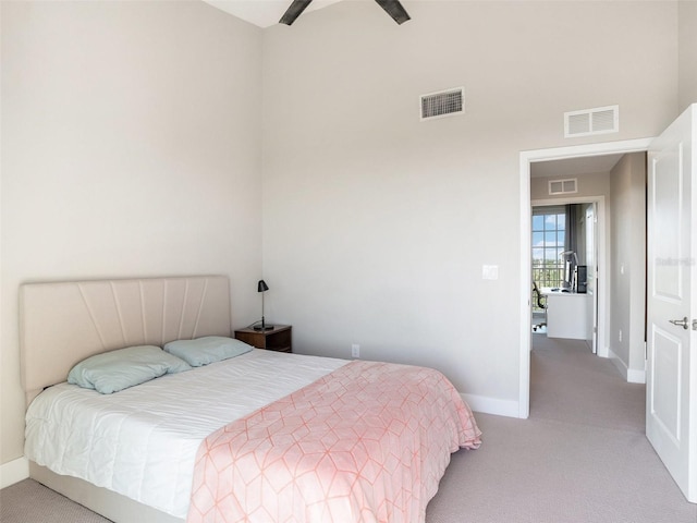 bedroom with light carpet and ceiling fan