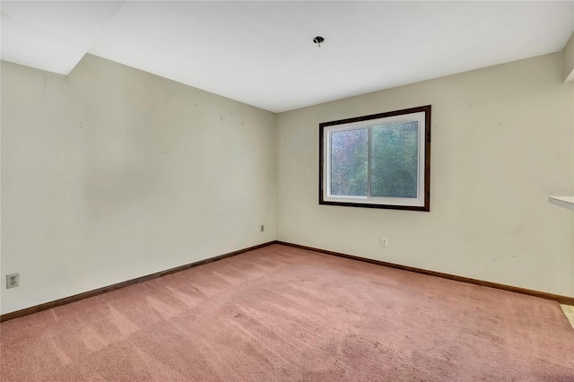 unfurnished room with light carpet