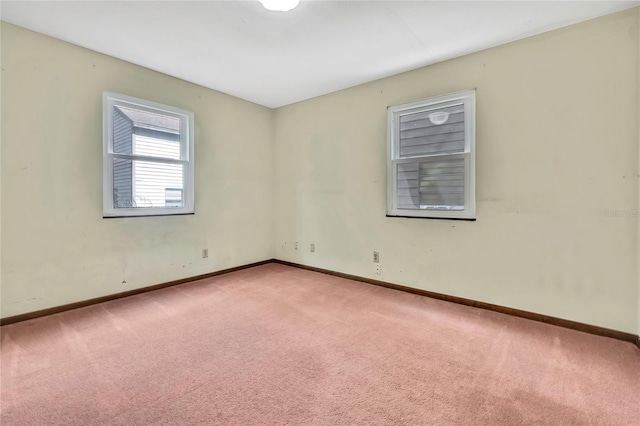 spare room with light carpet