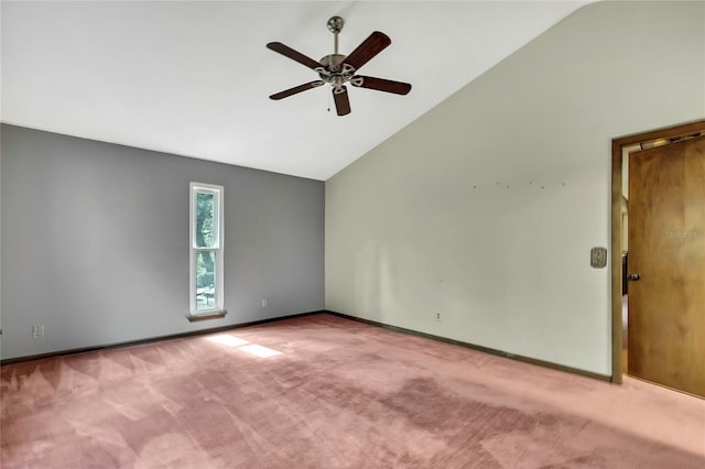 empty room featuring high vaulted ceiling, light colored carpet, and ceiling fan