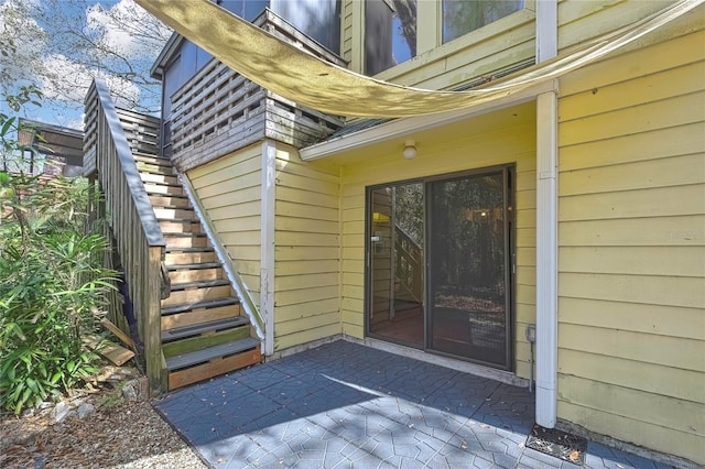 doorway to property with a patio area