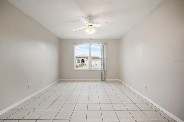 tiled empty room with ceiling fan