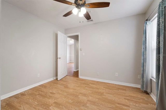 unfurnished room with ceiling fan and light hardwood / wood-style flooring