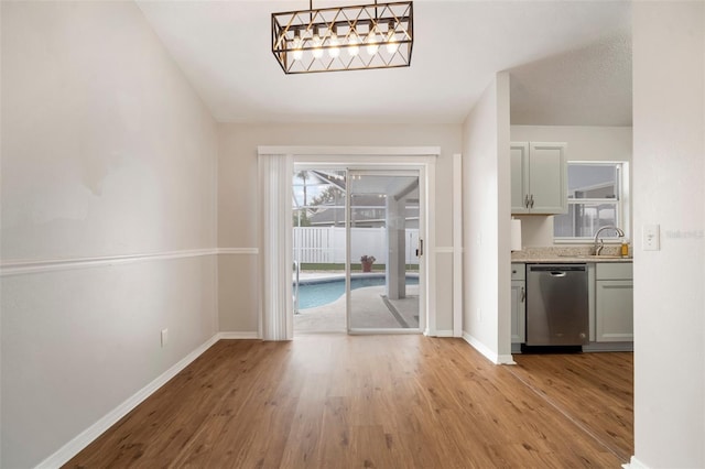 interior space with sink and light hardwood / wood-style flooring