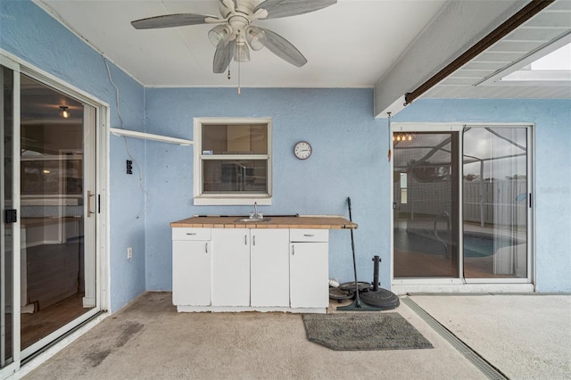 view of patio / terrace featuring sink and ceiling fan