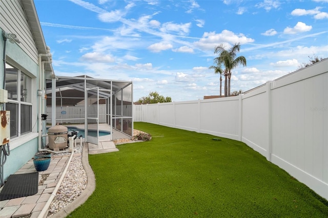 view of yard featuring a fenced in pool and a lanai