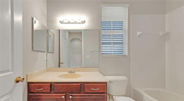 bathroom with toilet, washtub / shower combination, and vanity