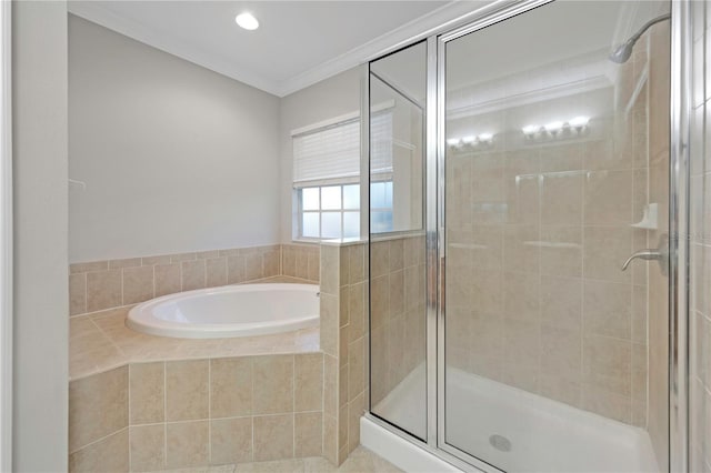 full bath with ornamental molding, a shower stall, and a bath