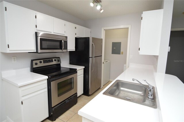 10263 Gandy Blvd N Unit 105, Saint Petersburg, FL 33702 - kitchen with stainless steel appliances, a sink, white cabinets, and electric panel
