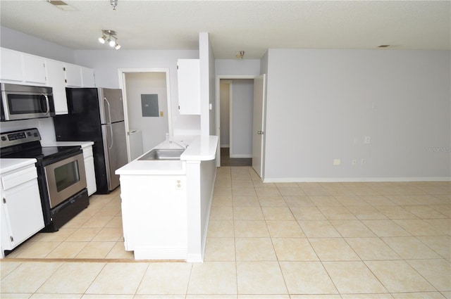 10263 Gandy Blvd N Unit 105, Saint Petersburg, FL 33702 - kitchen with appliances with stainless steel finishes, electric panel, a sink, light countertops, and light tile patterned floors