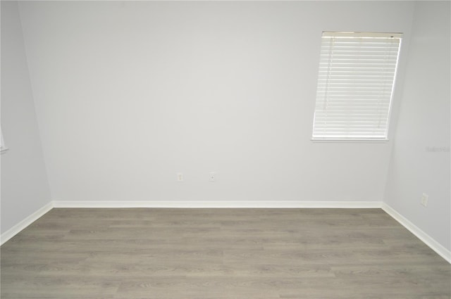 10263 Gandy Blvd N Unit 105, Saint Petersburg, FL 33702 - spare room featuring wood finished floors and baseboards