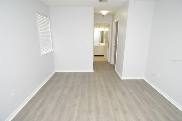 10263 Gandy Blvd N Unit 105, Saint Petersburg, FL 33702 - empty room with wood finished floors and baseboards