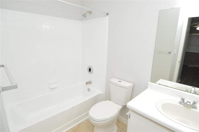 10263 Gandy Blvd N Unit 105, Saint Petersburg, FL 33702 - bathroom featuring toilet, vanity,  shower combination, tile patterned floors, and baseboards