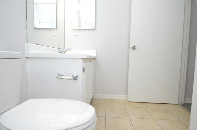 10263 Gandy Blvd N Unit 105, Saint Petersburg, FL 33702 - bathroom with vanity, tile patterned flooring, and baseboards