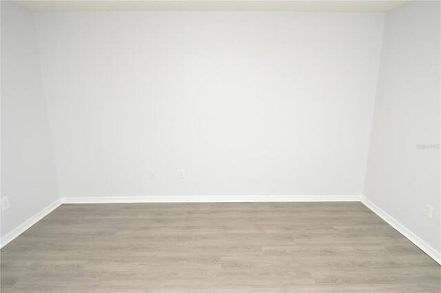 10263 Gandy Blvd N Unit 105, Saint Petersburg, FL 33702 - empty room with light wood-style floors and baseboards