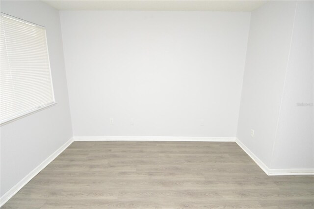 10263 Gandy Blvd N Unit 105, Saint Petersburg, FL 33702 - empty room with wood finished floors and baseboards