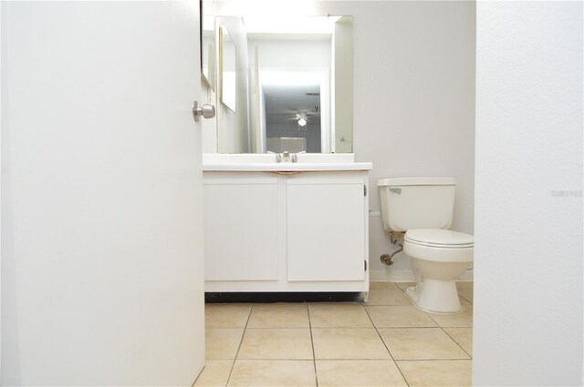 10263 Gandy Blvd N Unit 105, Saint Petersburg, FL 33702 - half bathroom featuring tile patterned floors, toilet, and vanity
