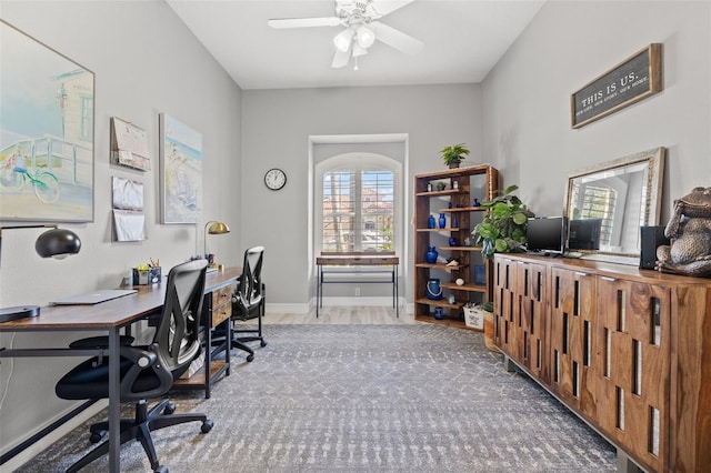 office with wood finished floors, a ceiling fan, and baseboards