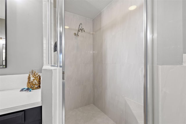 full bath featuring a shower stall and vanity