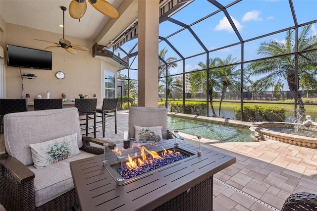 view of patio with an outdoor fire pit, a lanai, a pool with connected hot tub, and ceiling fan