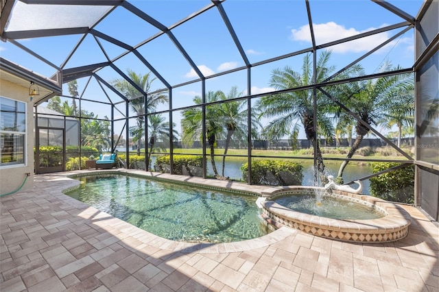 view of pool with a patio, a water view, a lanai, and a pool with connected hot tub