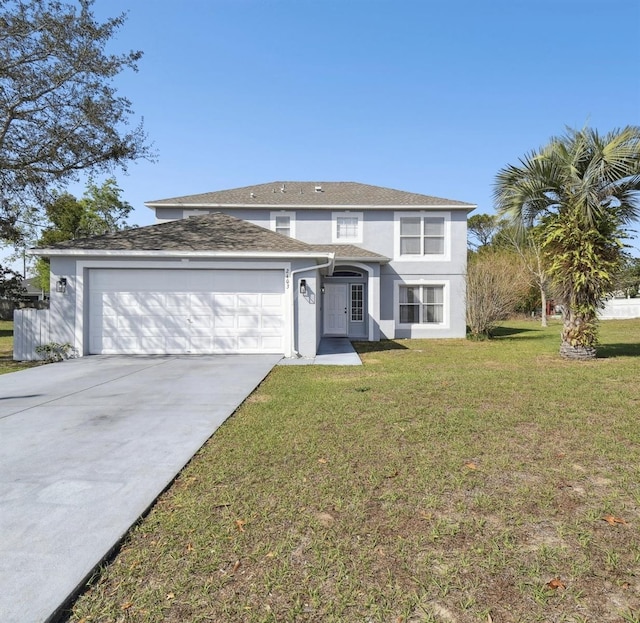 traditional home with a garage, stucco siding, concrete driveway, and a front yard