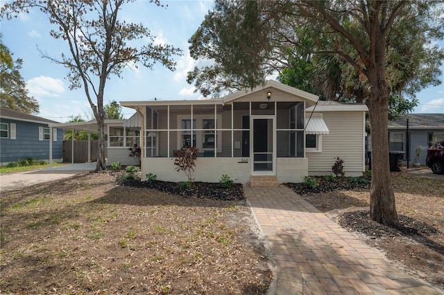 view of front of home with a sunroom