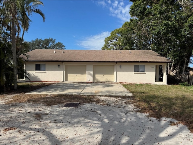 rear view of property featuring a garage