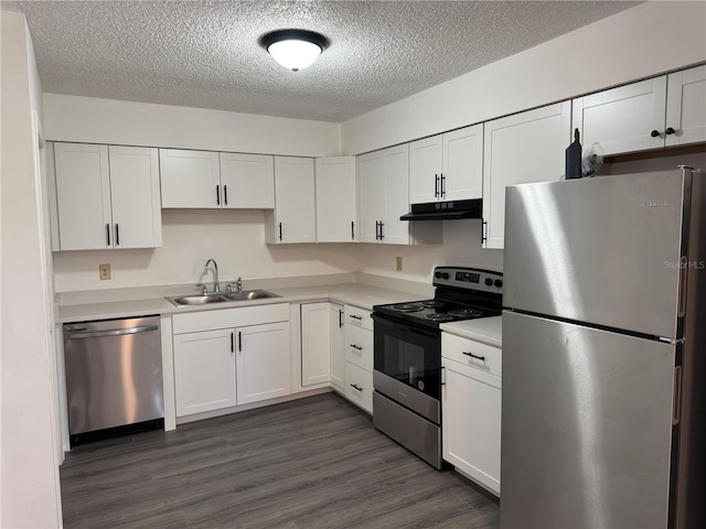 kitchen featuring sink, a textured ceiling, appliances with stainless steel finishes, dark hardwood / wood-style flooring, and white cabinets