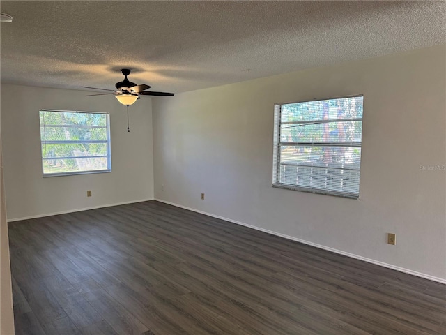 unfurnished room with ceiling fan, a textured ceiling, and dark hardwood / wood-style flooring