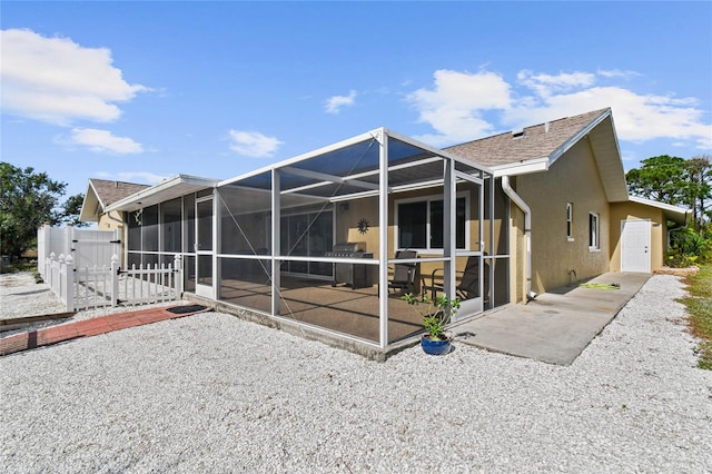 exterior space with a lanai and a patio