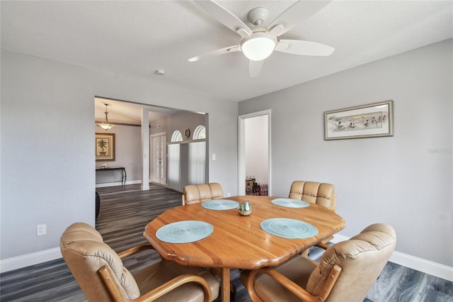 dining room featuring ceiling fan and dark hardwood / wood-style flooring