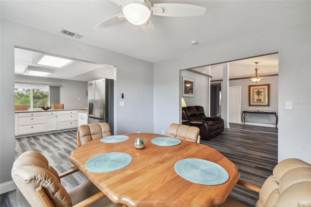 dining space featuring hardwood / wood-style floors and ceiling fan