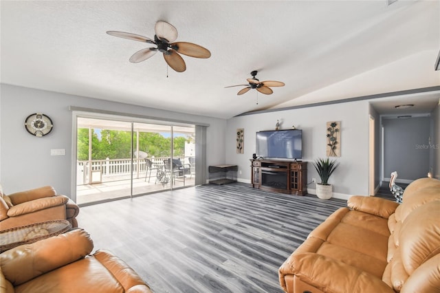 living room featuring wood-type flooring, lofted ceiling, ceiling fan, and a textured ceiling