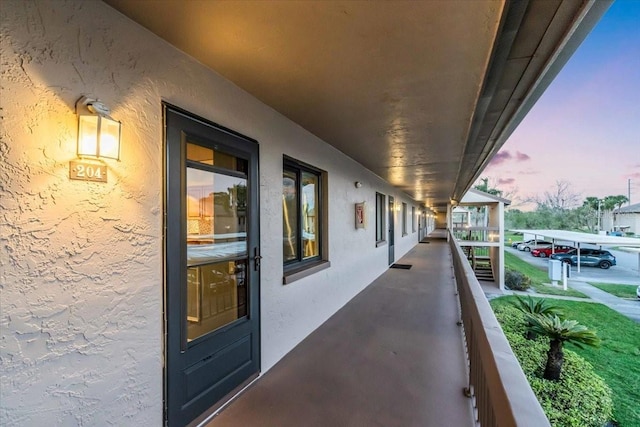 view of balcony at dusk