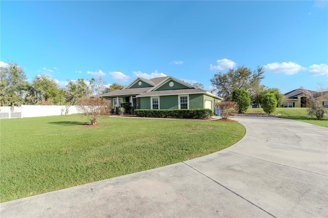 ranch-style house featuring a front lawn