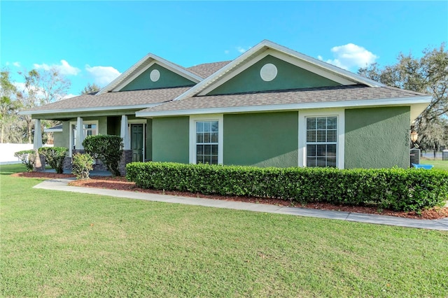 view of front of home with a front lawn