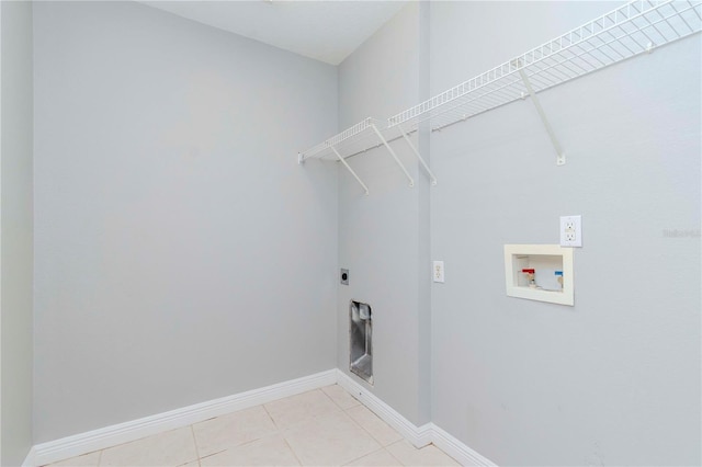 laundry room featuring electric dryer hookup, washer hookup, and light tile patterned flooring