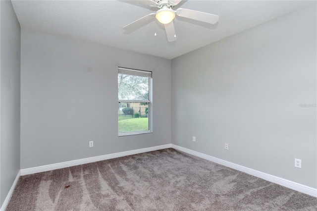 empty room with a textured ceiling, ceiling fan, and carpet flooring