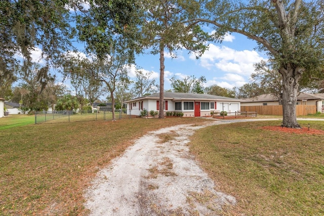 single story home with a front yard