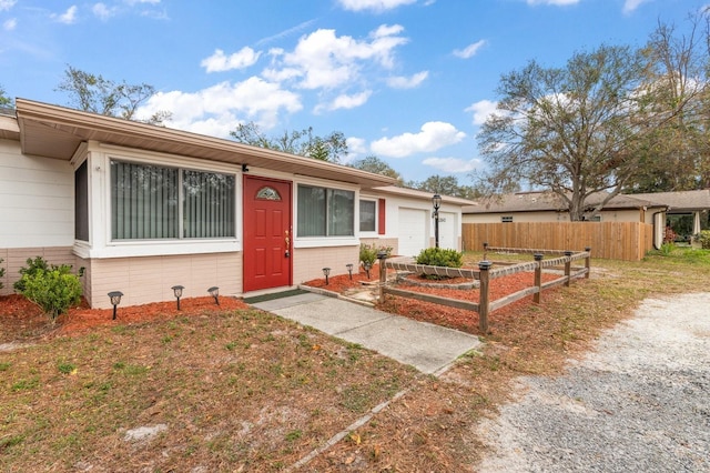 single story home featuring a garage